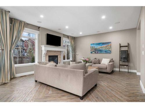 146 Auburn Sound Circle Se, Calgary, AB - Indoor Photo Showing Living Room With Fireplace