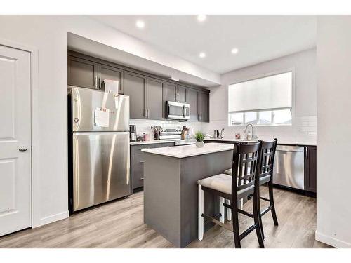 28 Edith Gate Nw, Calgary, AB - Indoor Photo Showing Kitchen With Stainless Steel Kitchen With Upgraded Kitchen