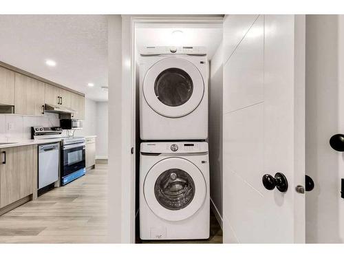 28 Edith Gate Nw, Calgary, AB - Indoor Photo Showing Laundry Room