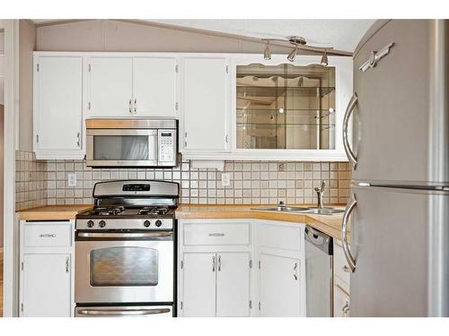 280235 Township Road 240, Rural Rocky View County, AB - Indoor Photo Showing Kitchen With Double Sink