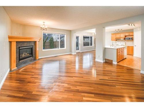 59 Somerset Manor Sw, Calgary, AB - Indoor Photo Showing Living Room With Fireplace