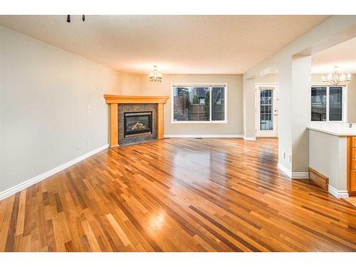 59 Somerset Manor Sw, Calgary, AB - Indoor Photo Showing Living Room With Fireplace