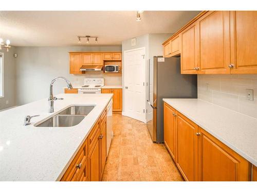 59 Somerset Manor Sw, Calgary, AB - Indoor Photo Showing Kitchen With Double Sink