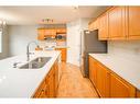 59 Somerset Manor Sw, Calgary, AB  - Indoor Photo Showing Kitchen With Double Sink 