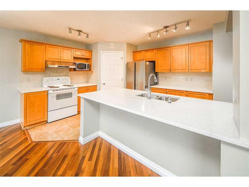 59 Somerset Manor Sw, Calgary, AB - Indoor Photo Showing Kitchen With Double Sink