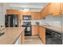 107-120 Country Village Circle Ne, Calgary, AB  - Indoor Photo Showing Kitchen With Double Sink 