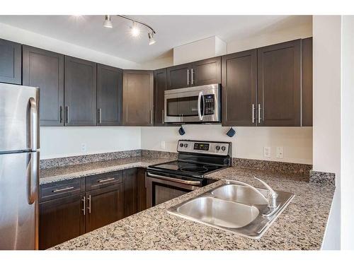 Suite 420-955 Mcpherson Road Ne, Calgary, AB - Indoor Photo Showing Kitchen With Stainless Steel Kitchen With Double Sink