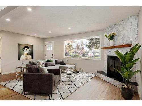 720 Alderwood Place Se, Calgary, AB - Indoor Photo Showing Living Room With Fireplace