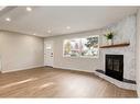 720 Alderwood Place Se, Calgary, AB  - Indoor Photo Showing Living Room With Fireplace 