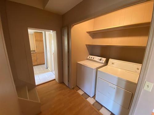 2303 23 Street, Nanton, AB - Indoor Photo Showing Laundry Room