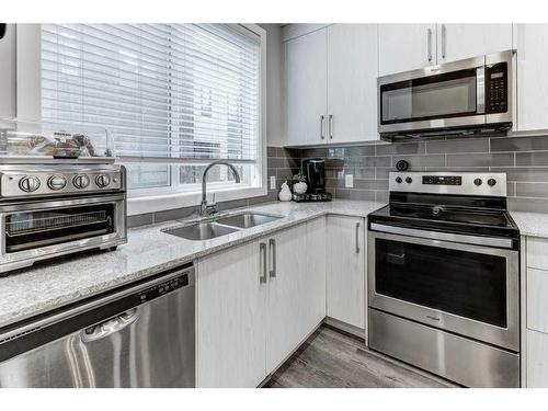 706 Redstone Crescent Ne, Calgary, AB - Indoor Photo Showing Kitchen With Double Sink With Upgraded Kitchen