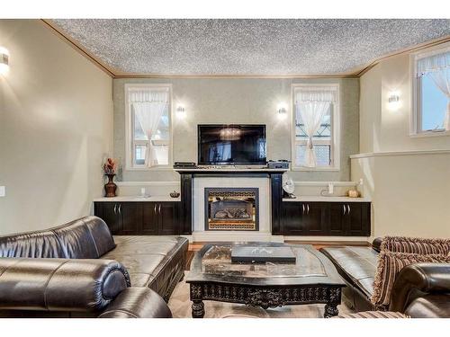 75 Gray Way, Rural Rocky View County, AB - Indoor Photo Showing Living Room With Fireplace