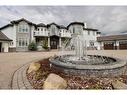 75 Gray Way, Rural Rocky View County, AB  - Outdoor With Balcony With Facade 