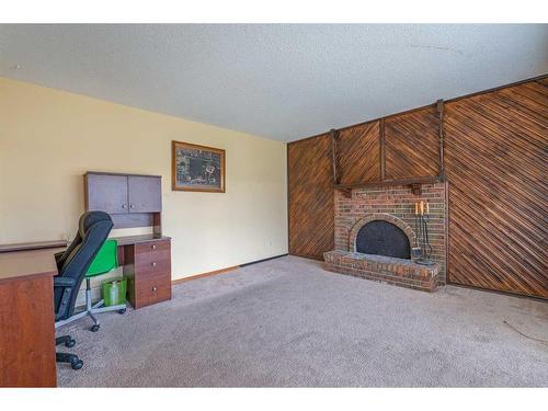 423 Queensland Circle Se, Calgary, AB - Indoor Photo Showing Office With Fireplace