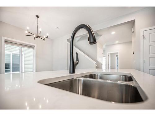 600 Baywater Manor Sw, Airdrie, AB - Indoor Photo Showing Kitchen With Double Sink