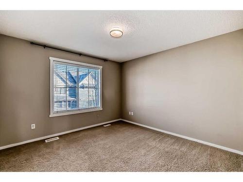 1204-125 Panatella Way Nw, Calgary, AB - Indoor Photo Showing Other Room