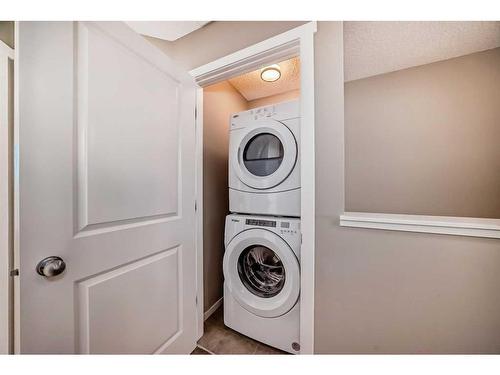 1204-125 Panatella Way Nw, Calgary, AB - Indoor Photo Showing Laundry Room