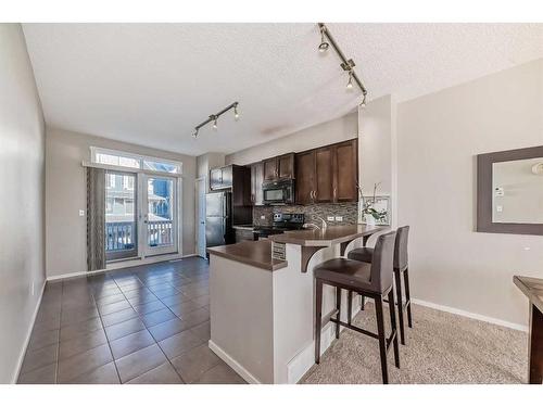 1204-125 Panatella Way Nw, Calgary, AB - Indoor Photo Showing Kitchen