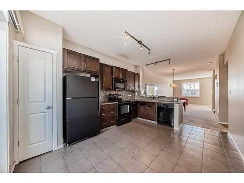 1204-125 Panatella Way Nw, Calgary, AB - Indoor Photo Showing Kitchen