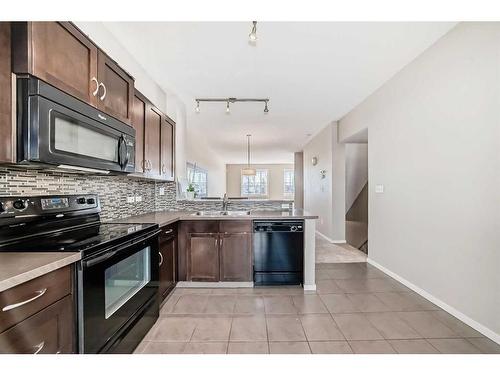 1204-125 Panatella Way Nw, Calgary, AB - Indoor Photo Showing Kitchen