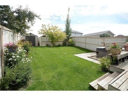 16 Cramond Drive Se, Calgary, AB - Outdoor With Backyard