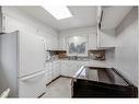 11039 Brae Road Sw, Calgary, AB  - Indoor Photo Showing Kitchen With Double Sink 