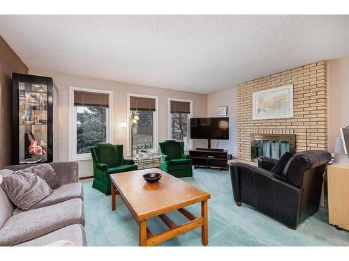 11039 Brae Road Sw, Calgary, AB - Indoor Photo Showing Living Room With Fireplace