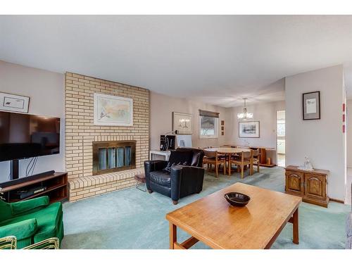 11039 Brae Road Sw, Calgary, AB - Indoor Photo Showing Living Room With Fireplace