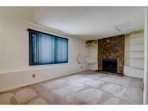 14787 Deer Ridge Drive Se, Calgary, AB - Indoor Photo Showing Living Room With Fireplace