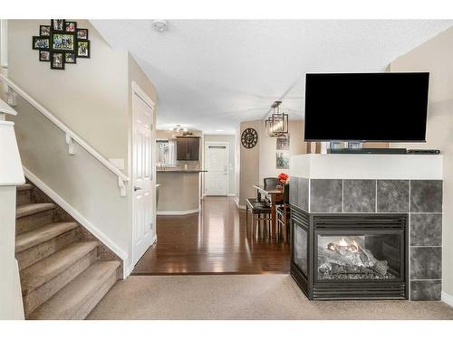 42 Silverado Plains Manor Sw, Calgary, AB - Indoor With Fireplace