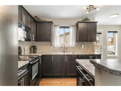 42 Silverado Plains Manor Sw, Calgary, AB - Indoor Photo Showing Kitchen With Double Sink With Upgraded Kitchen