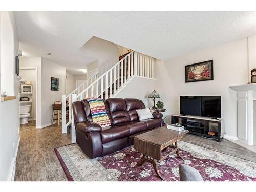 11-117 Bow Ridge Drive, Cochrane, AB - Indoor Photo Showing Living Room