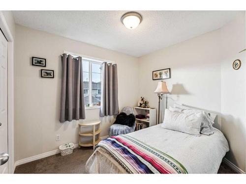 11-117 Bow Ridge Drive, Cochrane, AB - Indoor Photo Showing Bedroom