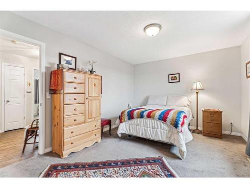 11-117 Bow Ridge Drive, Cochrane, AB - Indoor Photo Showing Bedroom