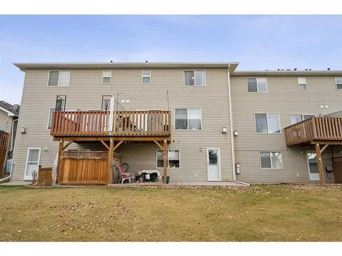 11-117 Bow Ridge Drive, Cochrane, AB - Outdoor With Balcony With Deck Patio Veranda With Exterior