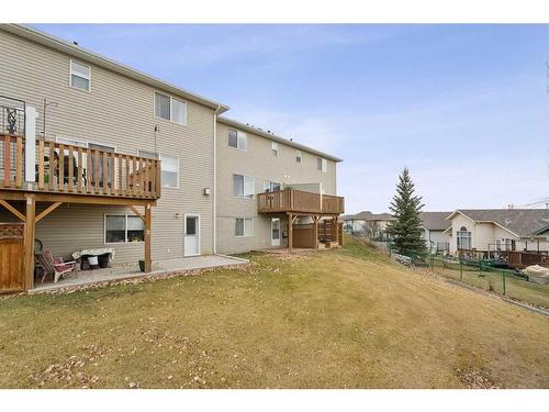 11-117 Bow Ridge Drive, Cochrane, AB - Outdoor With Balcony With Deck Patio Veranda With Exterior