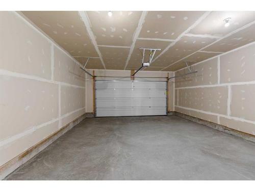 400-15 Coopersfield Sw, Airdrie, AB - Indoor Photo Showing Garage