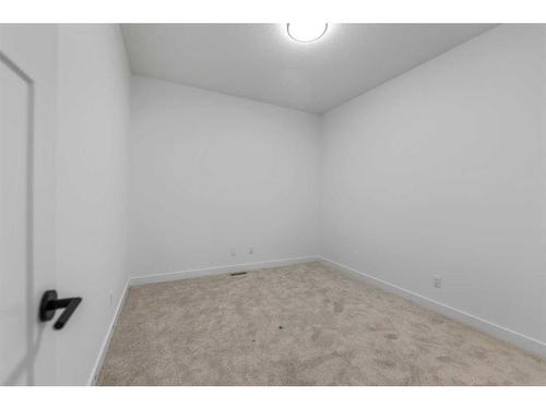 400-15 Coopersfield Sw, Airdrie, AB - Indoor Photo Showing Other Room