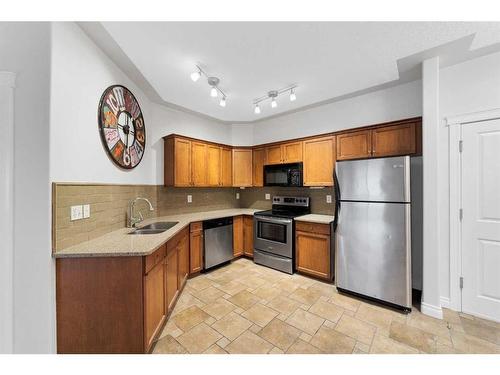 309-2411 Erlton Road Sw, Calgary, AB - Indoor Photo Showing Kitchen With Stainless Steel Kitchen With Double Sink