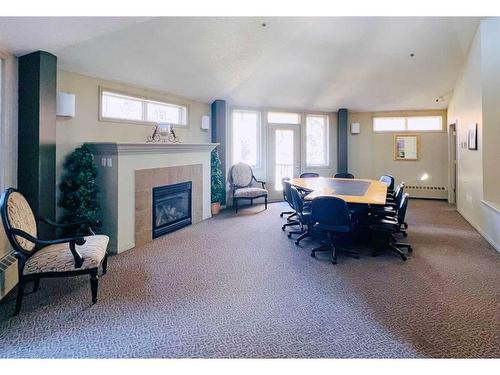 309-2411 Erlton Road Sw, Calgary, AB - Indoor With Fireplace