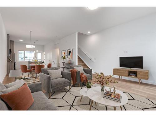 502-101 Panatella Square Nw, Calgary, AB - Indoor Photo Showing Living Room