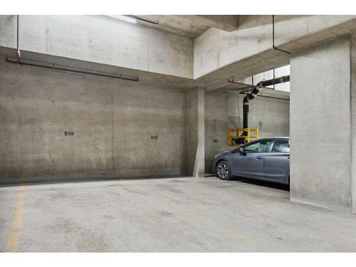 606-205 Riverfront Avenue Sw, Calgary, AB - Indoor Photo Showing Garage