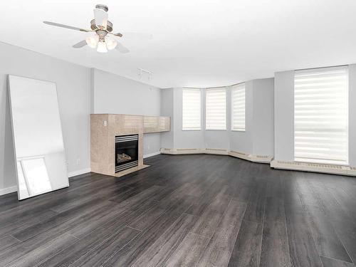 907-1108 6 Avenue Sw, Calgary, AB - Indoor Photo Showing Living Room With Fireplace