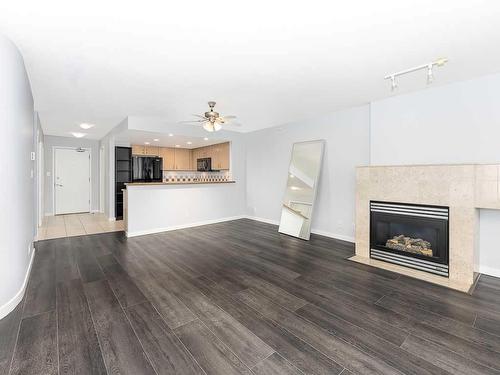 907-1108 6 Avenue Sw, Calgary, AB - Indoor Photo Showing Living Room With Fireplace