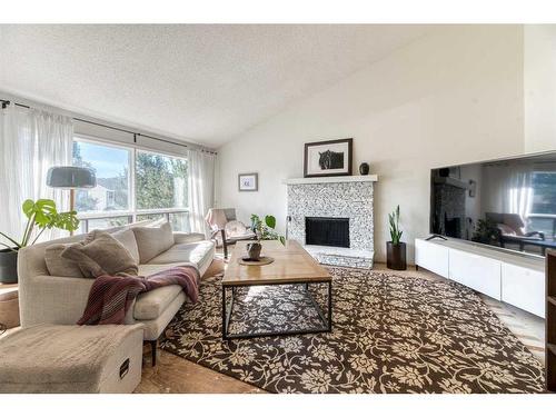 8518 47 Avenue Nw, Calgary, AB - Indoor Photo Showing Living Room With Fireplace