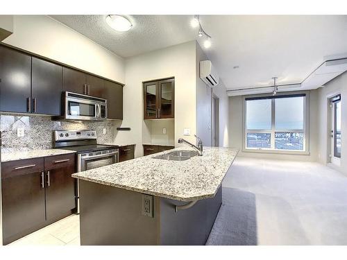 1210-8880 Horton Road Sw, Calgary, AB - Indoor Photo Showing Kitchen With Double Sink With Upgraded Kitchen