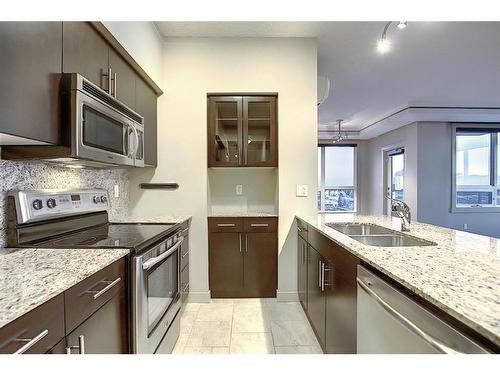 1210-8880 Horton Road Sw, Calgary, AB - Indoor Photo Showing Kitchen With Stainless Steel Kitchen With Double Sink With Upgraded Kitchen