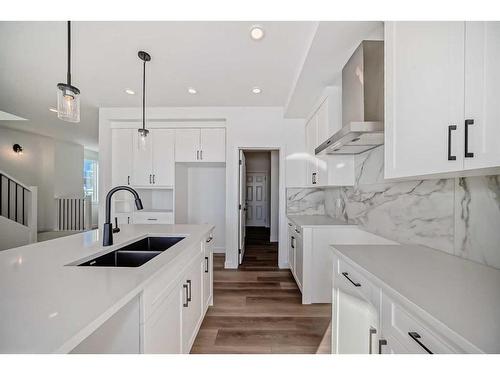 103 Saddlebred Place, Cochrane, AB - Indoor Photo Showing Kitchen With Double Sink With Upgraded Kitchen