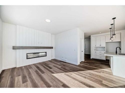 103 Saddlebred Place, Cochrane, AB - Indoor Photo Showing Living Room With Fireplace