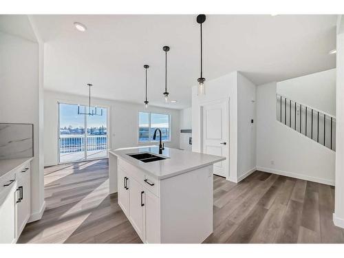 103 Saddlebred Place, Cochrane, AB - Indoor Photo Showing Kitchen With Double Sink With Upgraded Kitchen